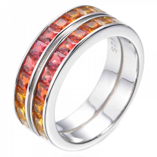Серебряное кольцо с родиевым покрытием 925 пробы с двумя рядами градуированных оранжевых принцесс
 
