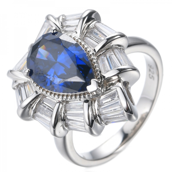 Серебряное кольцо с грушевидным синим танзанитом 925 пробы и белым кубическим цирконием с родиевым покрытием
 