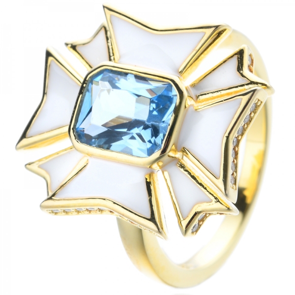 Кольцо серебра плакировкой желтого золота белой эмали 18к с центром голубого топаза
 